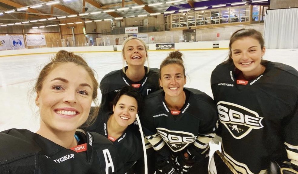 Kelly Murray (left) poses with her teammates of SDE