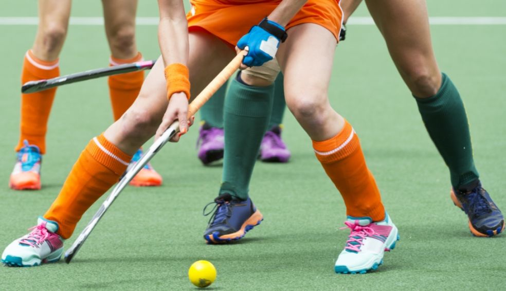 Women hockey players on the ball Women hockey players on the ball
