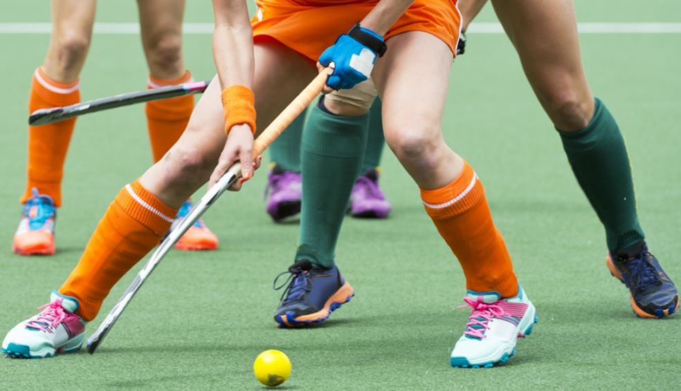 Women hockey players on the ball