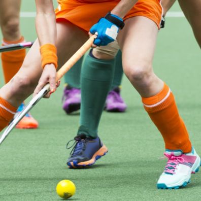 Women hockey players on the ball