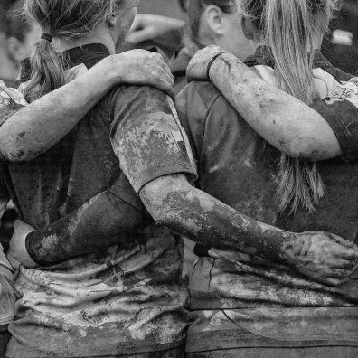 Rugby team hugged together